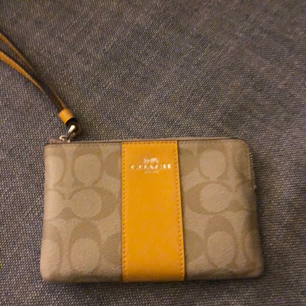 Brand new; never used Coach wristlet.